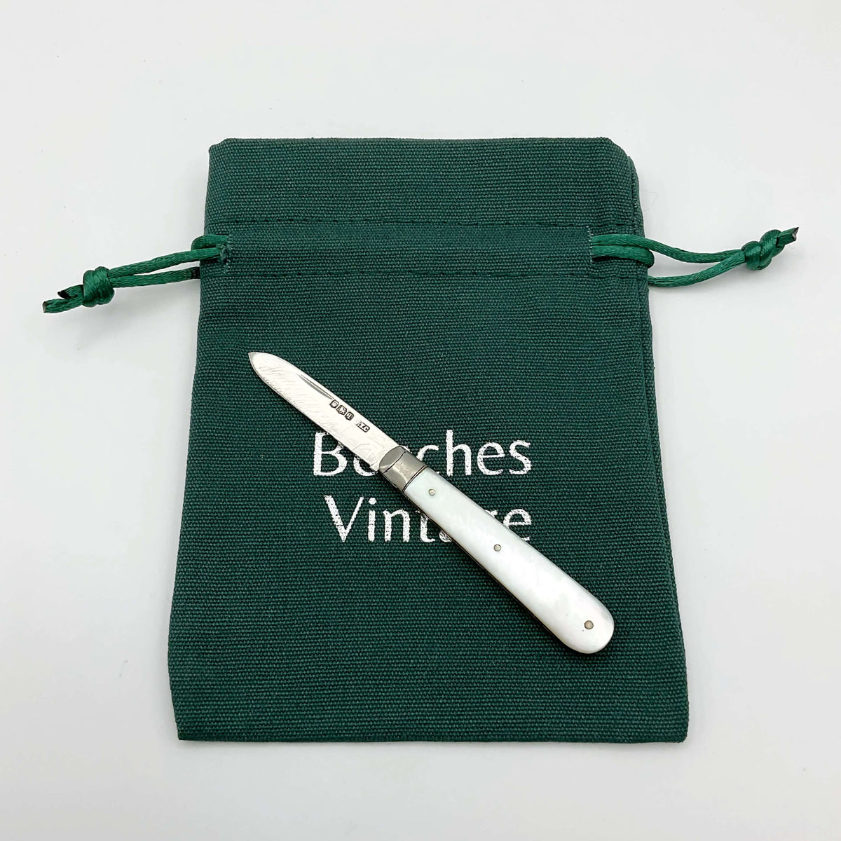Vintage 1928 Beeches Vintage sterling silver fruit knife with ornate handle and sharp blade, classic antique cutlery piece.