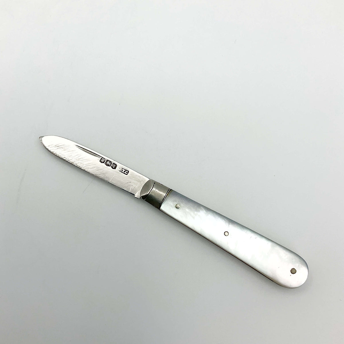 Vintage 1928 Beeches Vintage sterling silver fruit knife with ornate handle and blade, displayed on a neutral background.