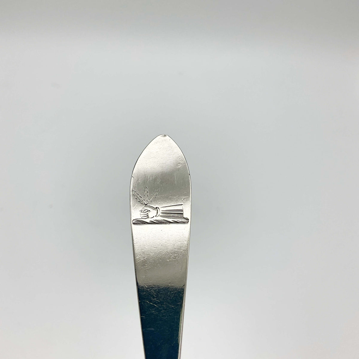 Antique 1788 solid silver dessert spoon by Beeches Vintage, showing intricate engraved design and polished surface.