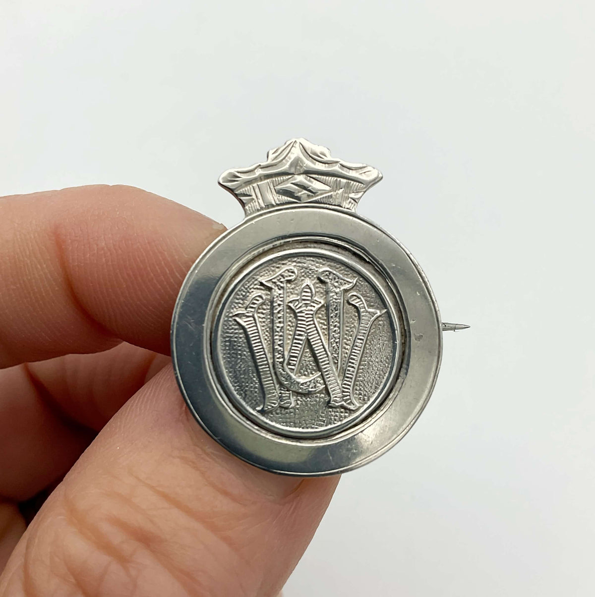 Vintage 1920s Sterling Silver Union Badge with detailed engraving, from Beeches Vintage, showcasing historical craftsmanship.