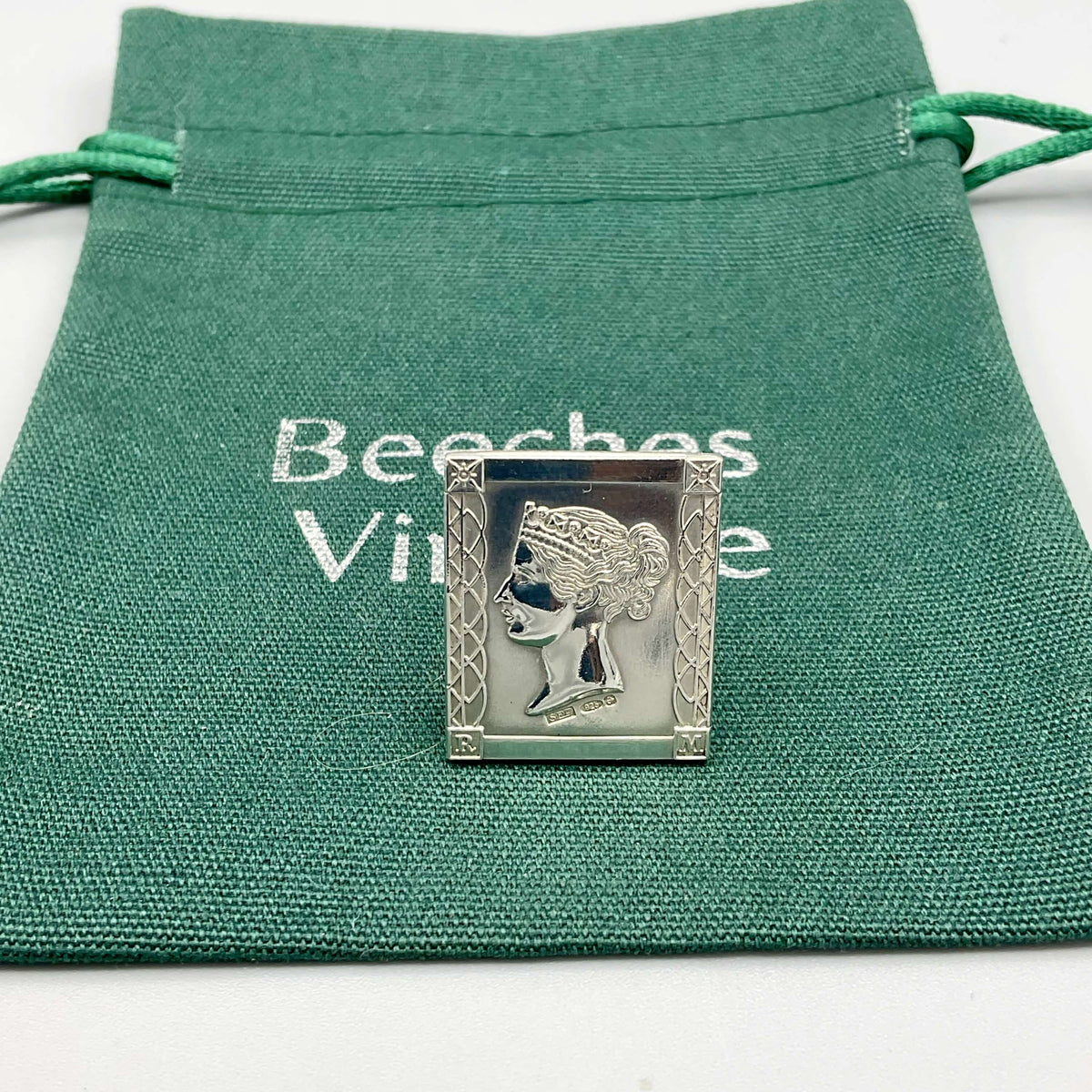 Sterling silver Queen Victoria postage stamp medal by Beeches Vintage, featuring detailed Victorian-era design and engraving.