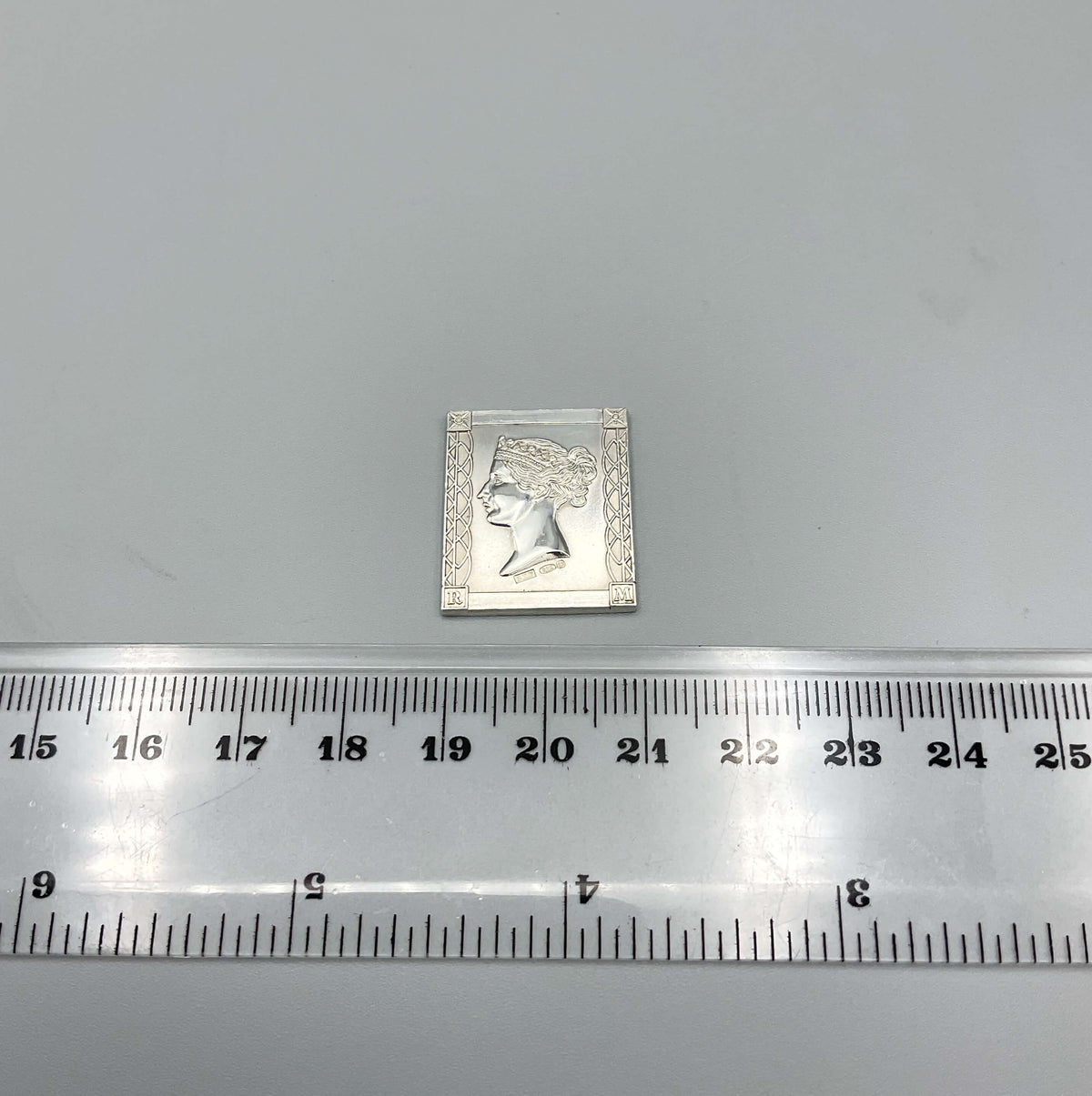Sterling silver Queen Victoria postage stamp medal by Beeches Vintage, detailed embossed design on a polished silver surface.