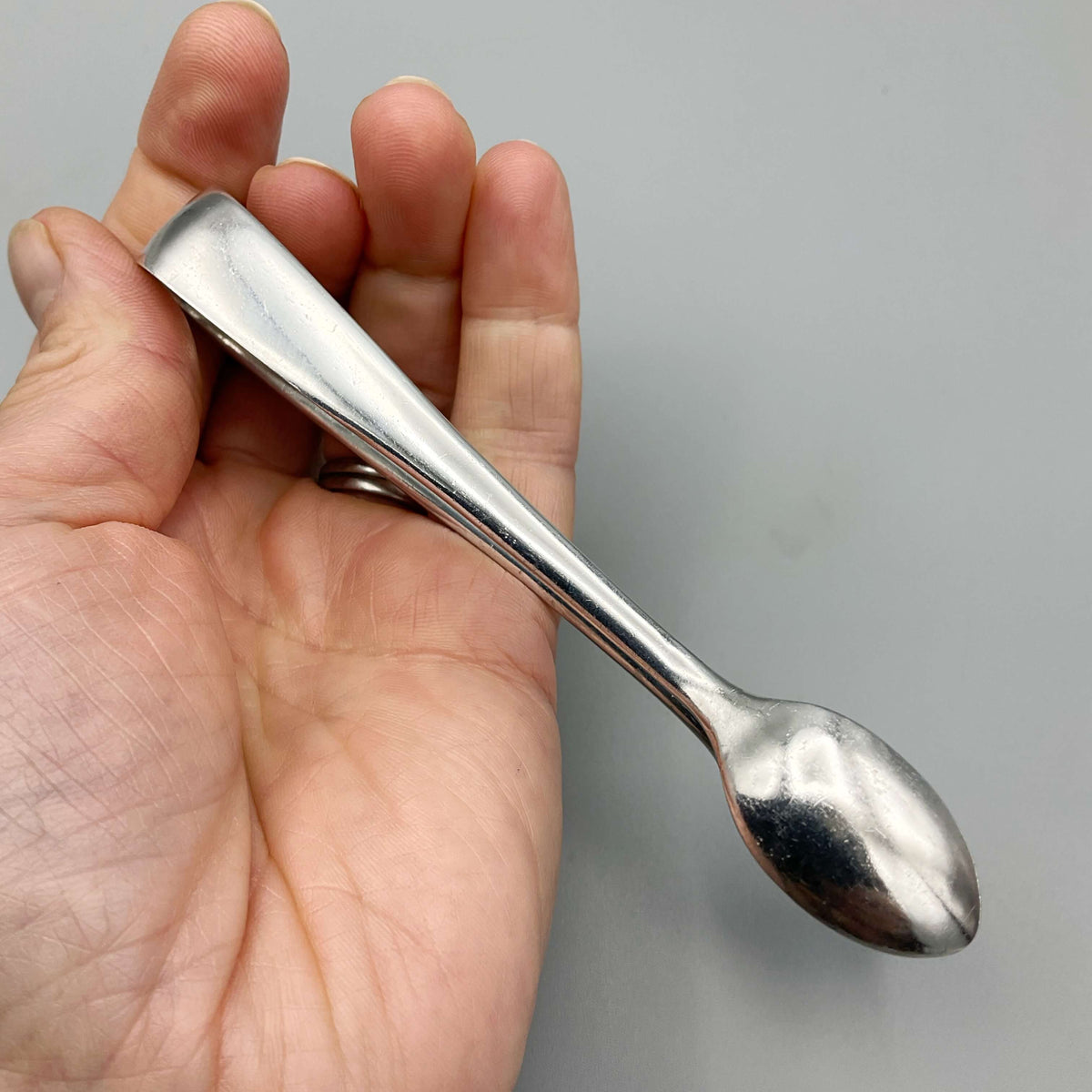 Vintage silver-plated sugar tongs by Beeches Vintage, showcasing elegant design and polished finish for serving sugar.