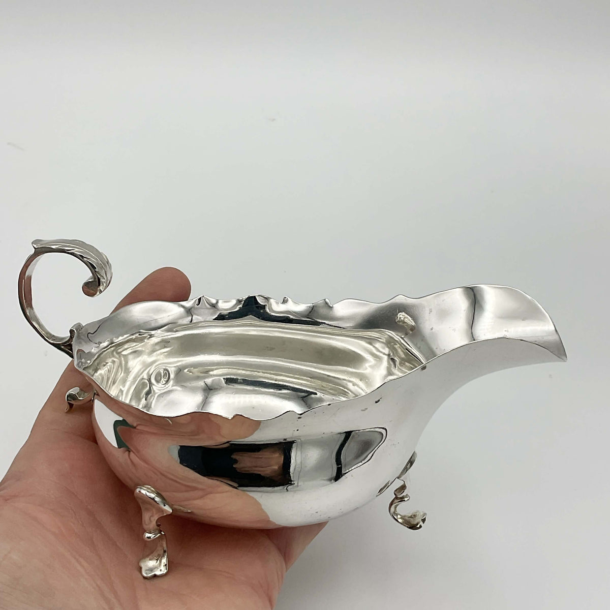 Antique 1902 solid silver sauce boat by Beeches Vintage, featuring elegant design and polished finish.