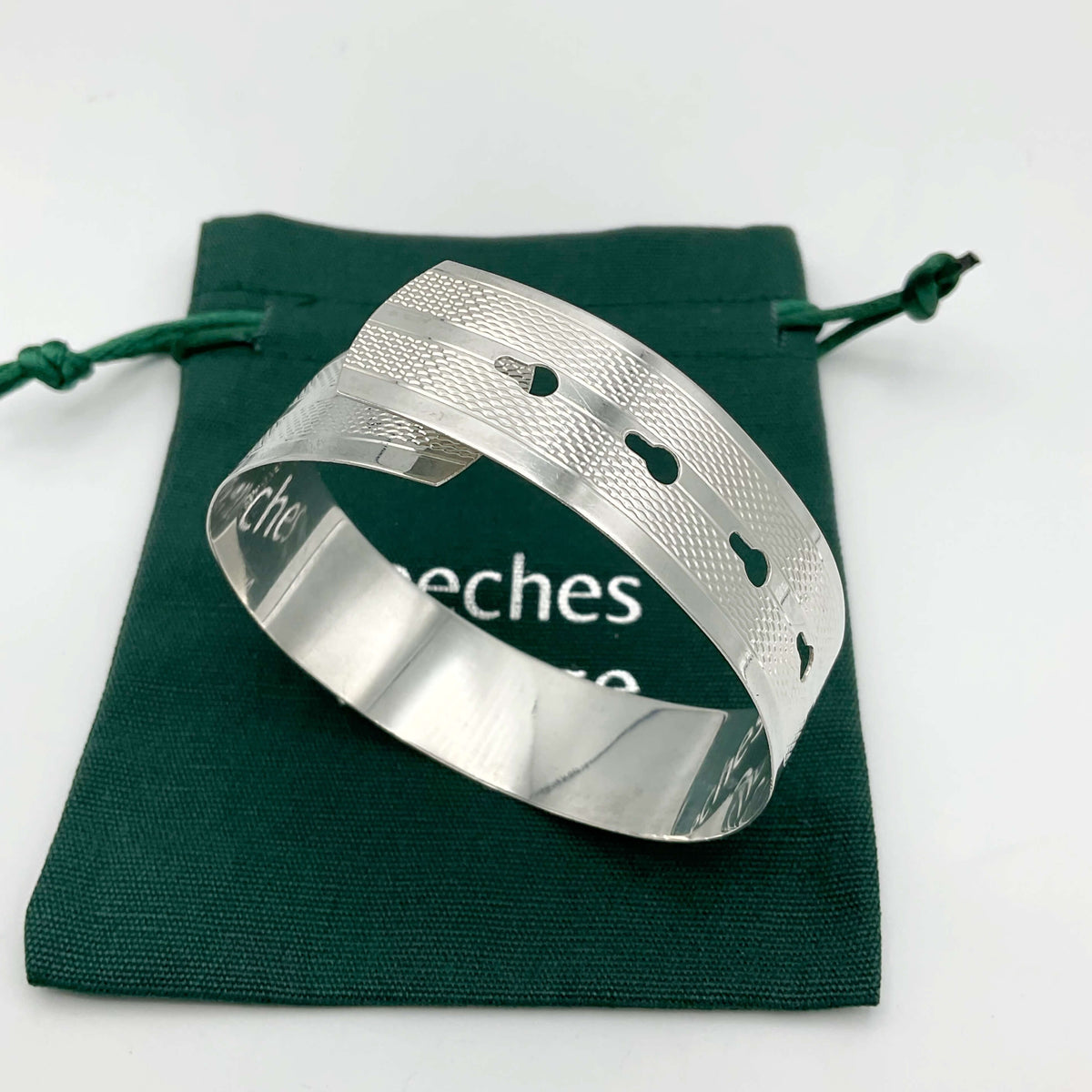 Silver adjustable bangle bracelet by Beeches Vintage featuring a sleek, minimalist design and smooth finish.