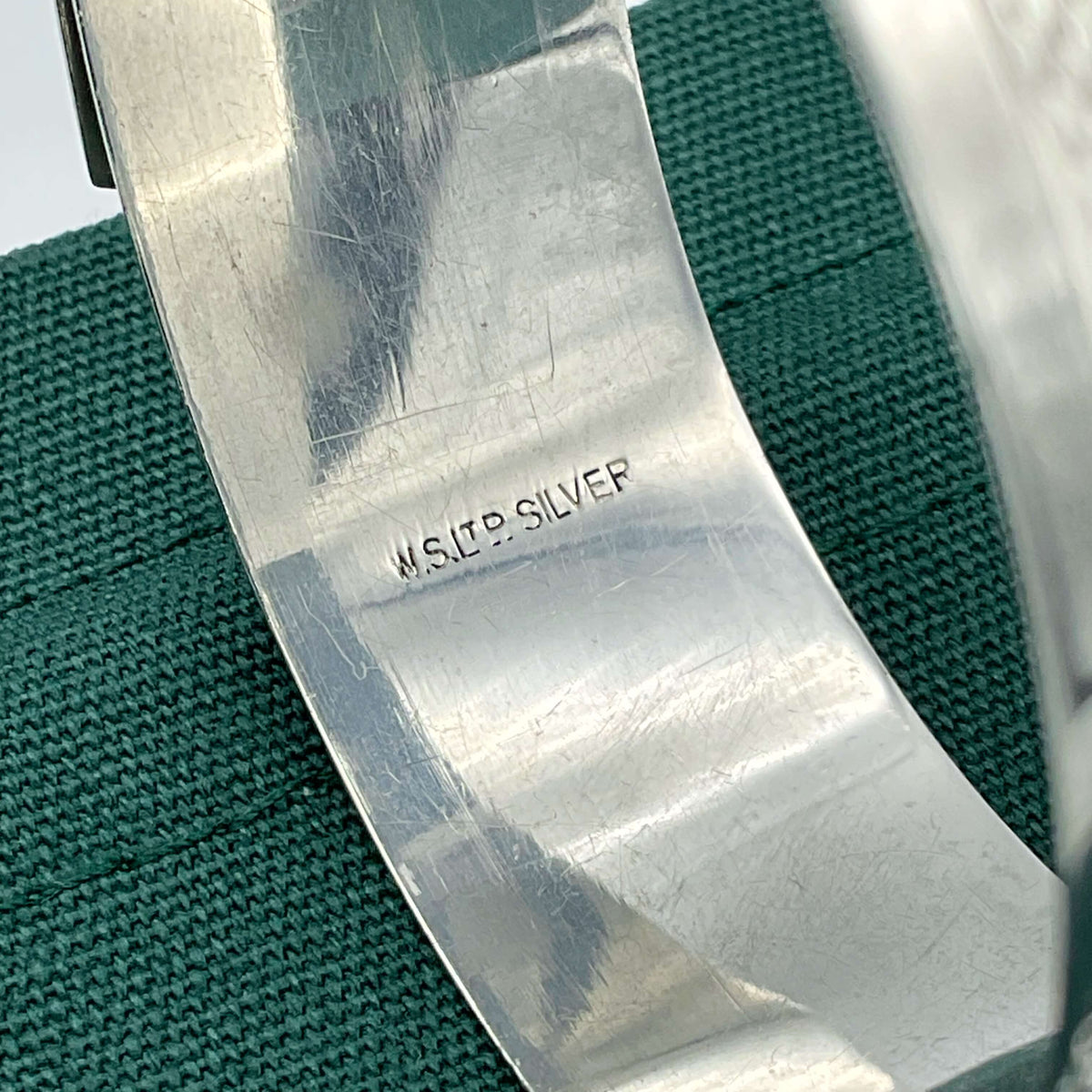 Silver adjustable bangle bracelet by Beeches Vintage, featuring a sleek, polished design with a secure clasp and minimalist style.