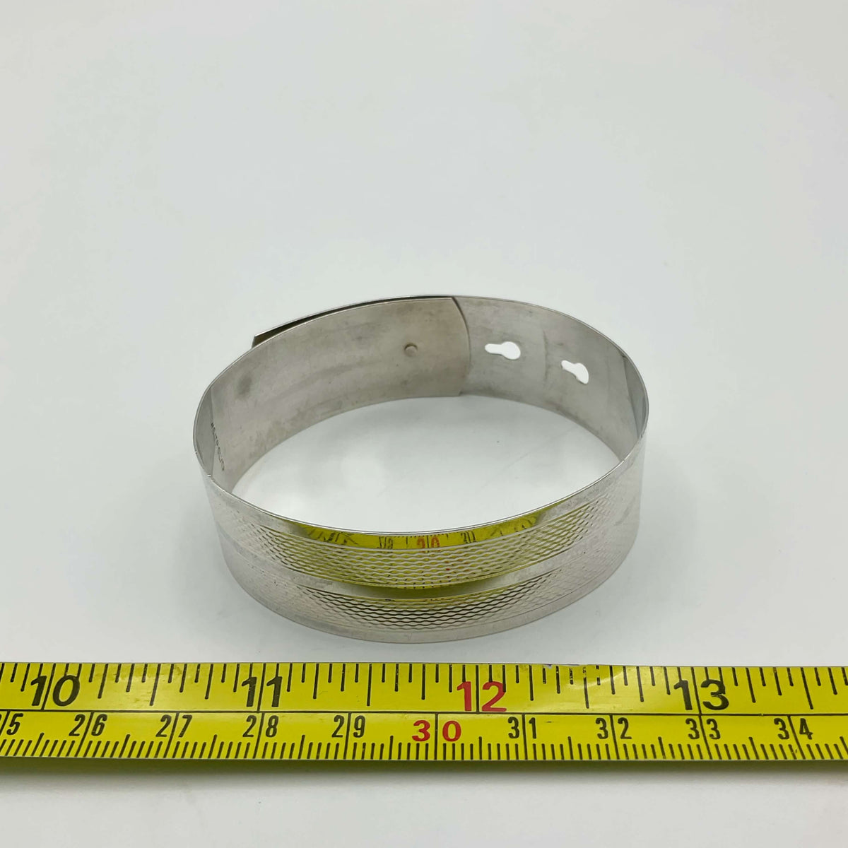 Silver adjustable bangle bracelet by Beeches Vintage, featuring a sleek, minimalist design with smooth, polished surface.