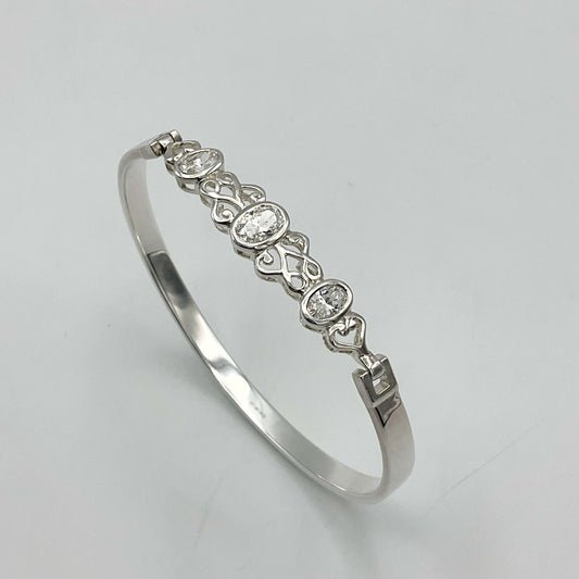 Sterling silver hinged bangle bracelet with cubic zirconia accents, designed by Beeches Vintage, showcasing elegant jewelry craftsmanship.