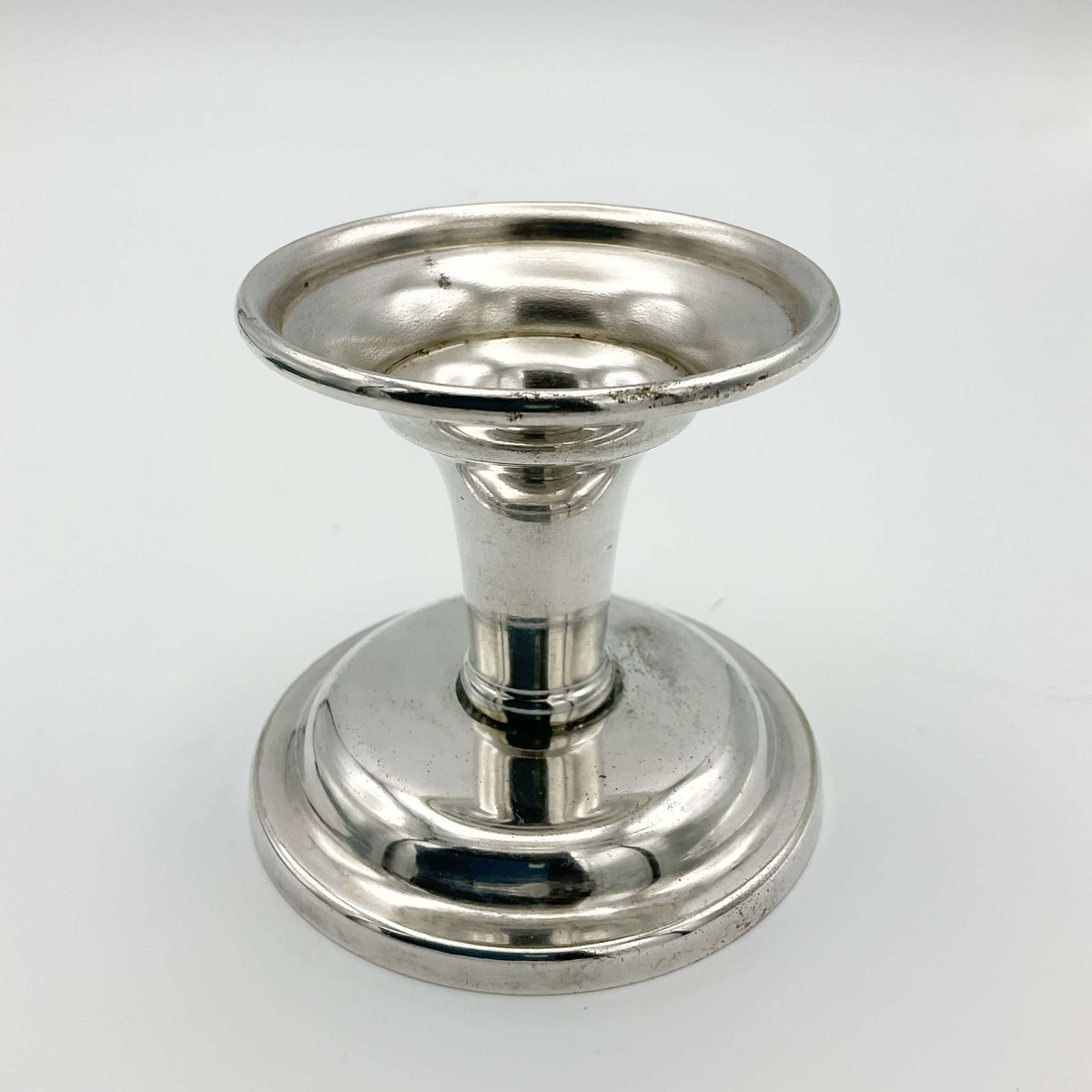 Silver plated vintage 1960s candlestick holder with ornate design, perfect for classic home decor, by Beeches Vintage.