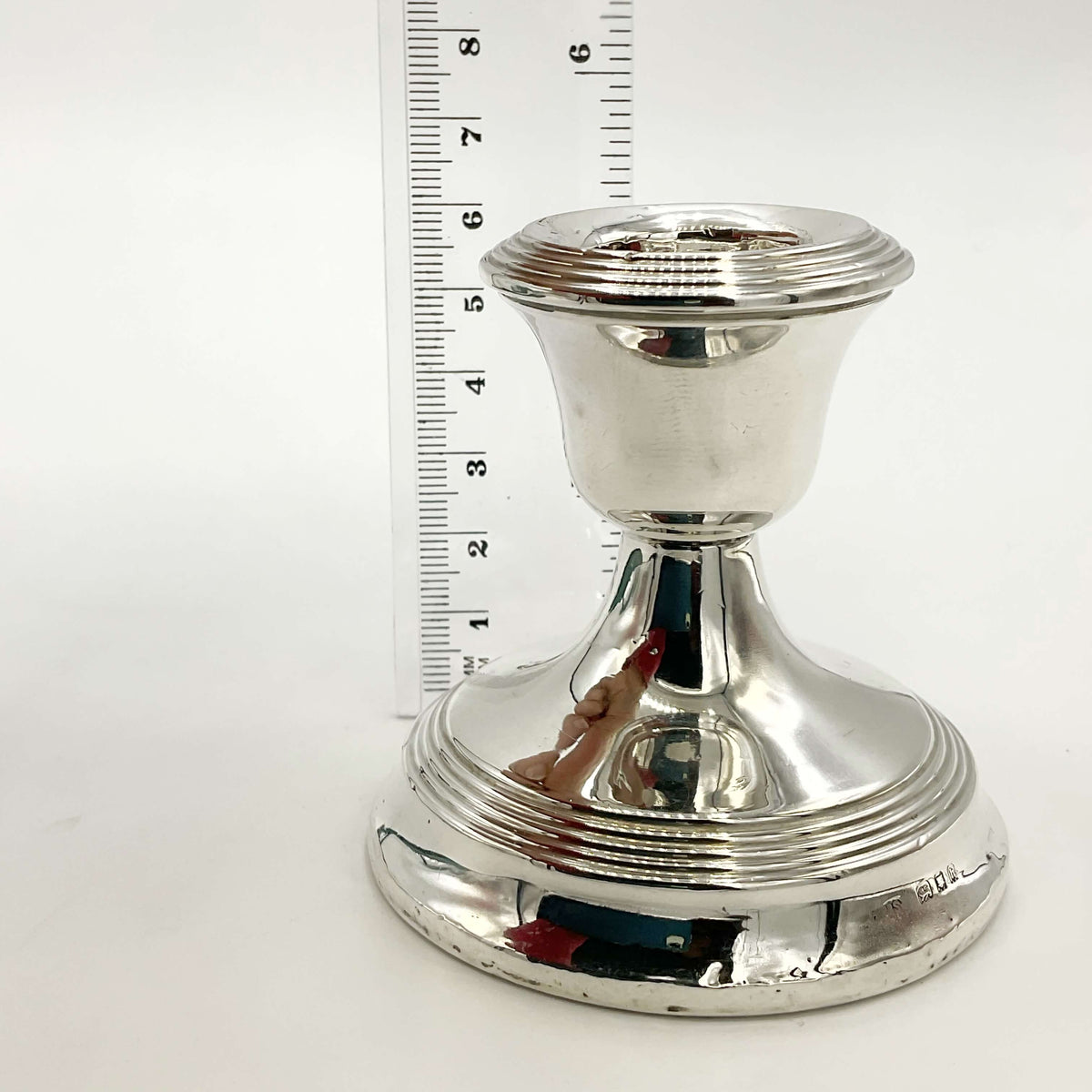 Antique sterling silver candle holder from Beeches Vintage, decorative candlestick holder with intricate detailing.