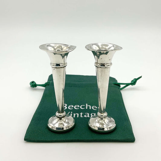 Pair of small sterling silver spill vases with intricate patterns, designed for elegant floral arrangements, by Beeches Vintage.