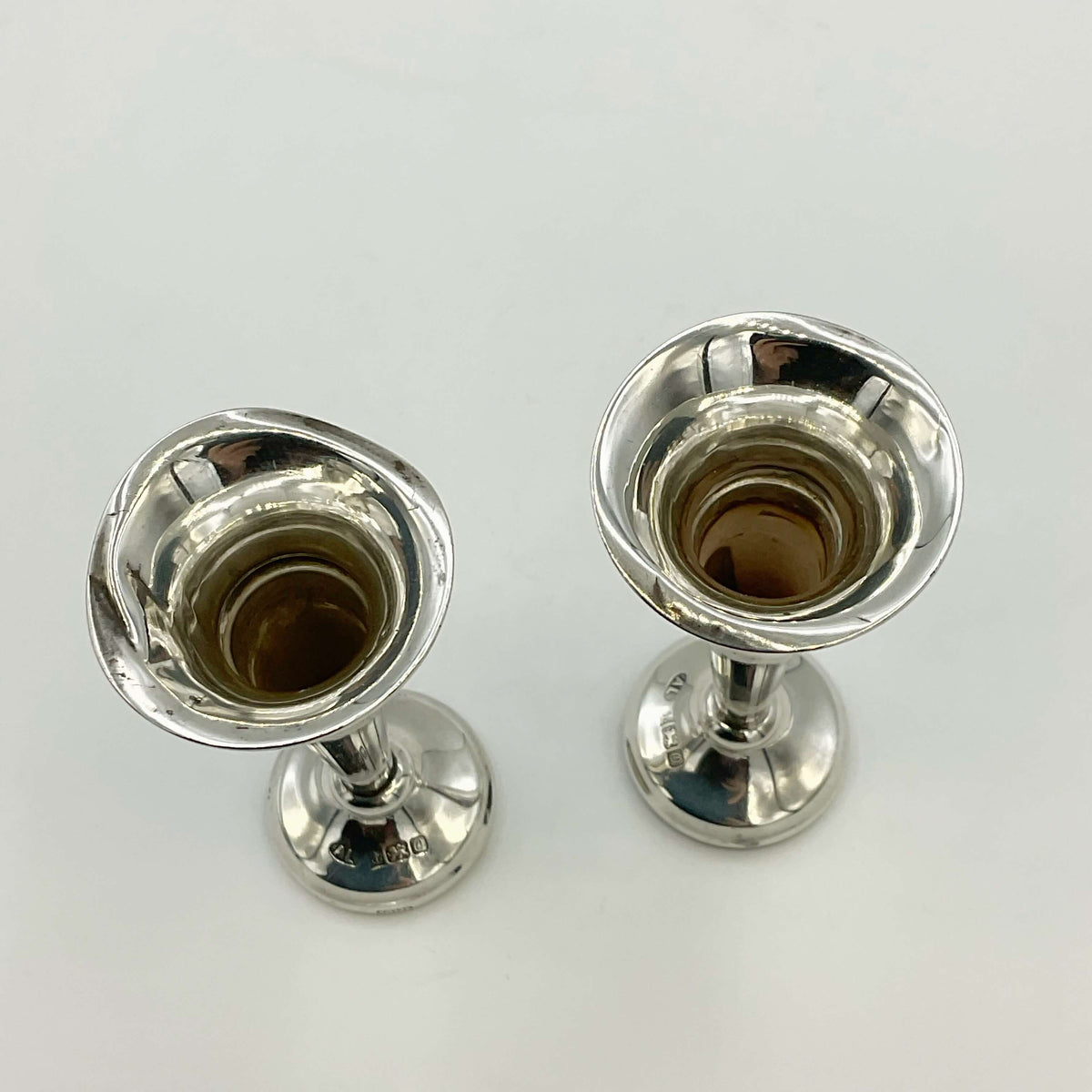 Pair of small sterling silver spill vases with intricate designs, perfect for floral arrangements, by Beeches Vintage.