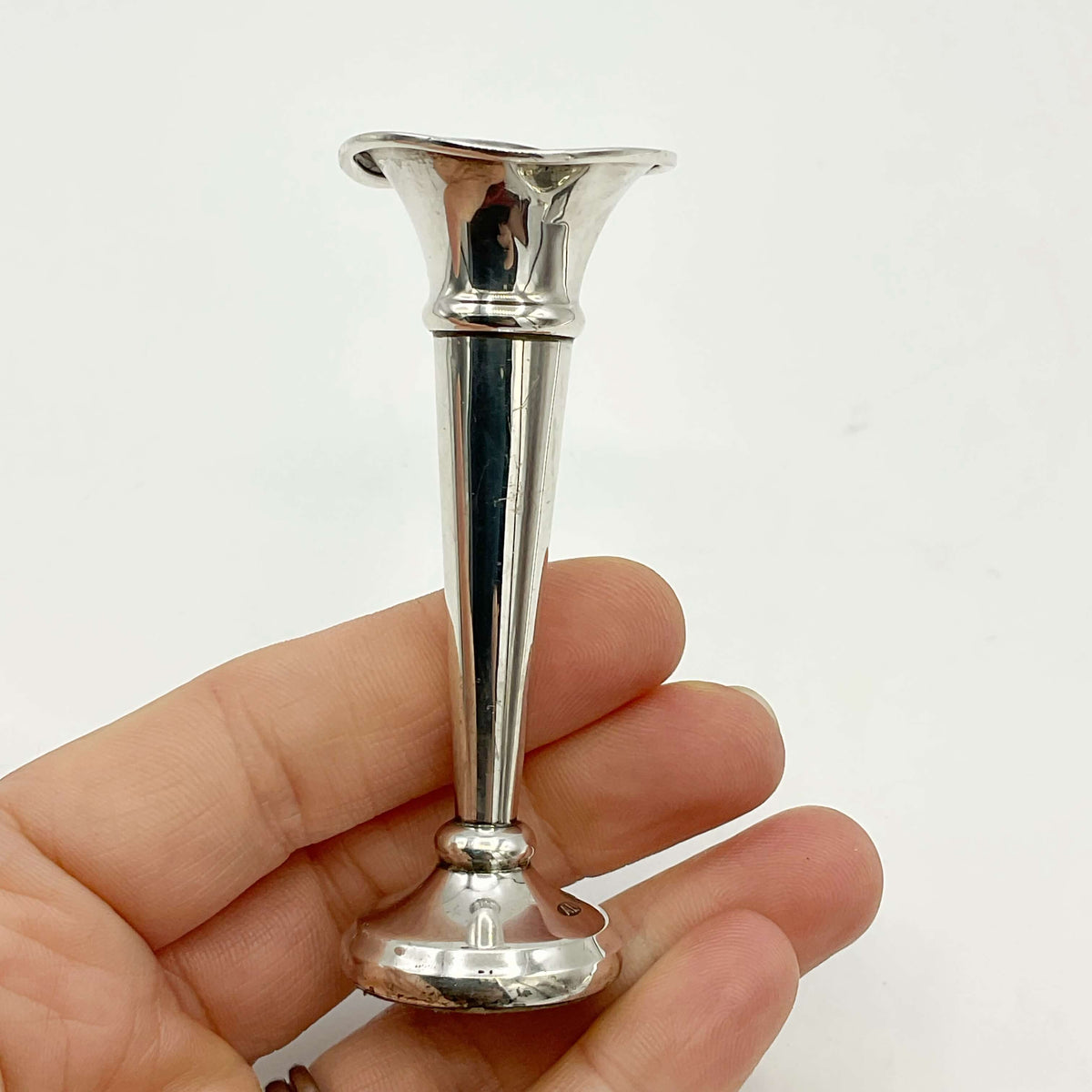 Pair of small sterling silver spill vases by Beeches Vintage, featuring intricate engraved details and a polished finish.