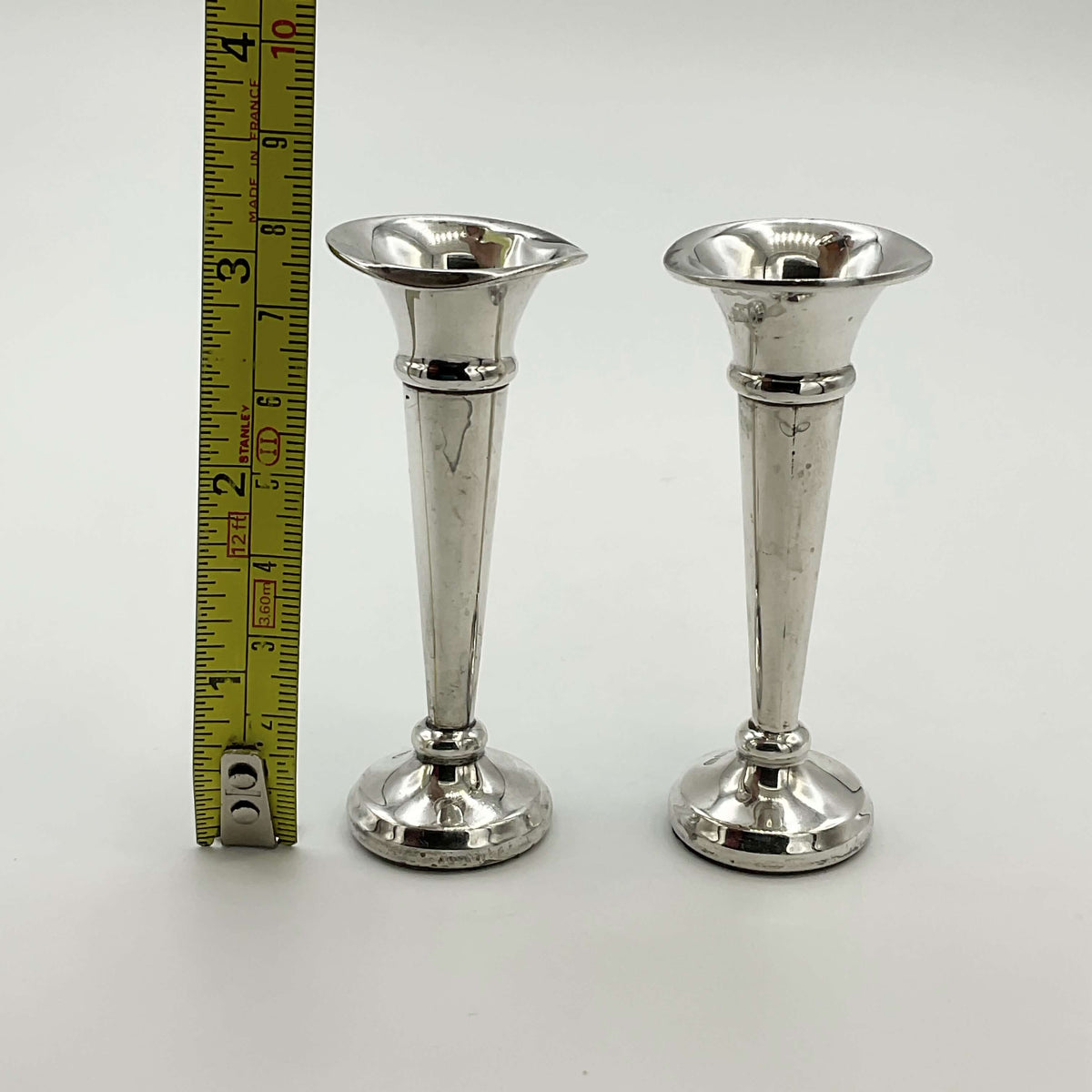 Pair of small sterling silver spill vases with intricate detailing, designed by Beeches Vintage, perfect for floral arrangements.