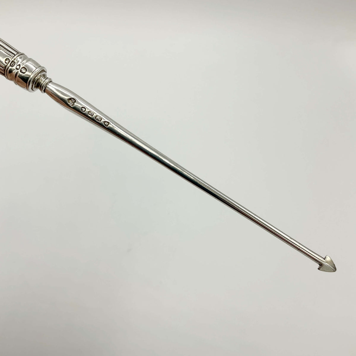 Antique Victorian sterling silver arrowhead tool accessory from Beeches Vintage, detailed craftsmanship, vintage jewelry piece.
