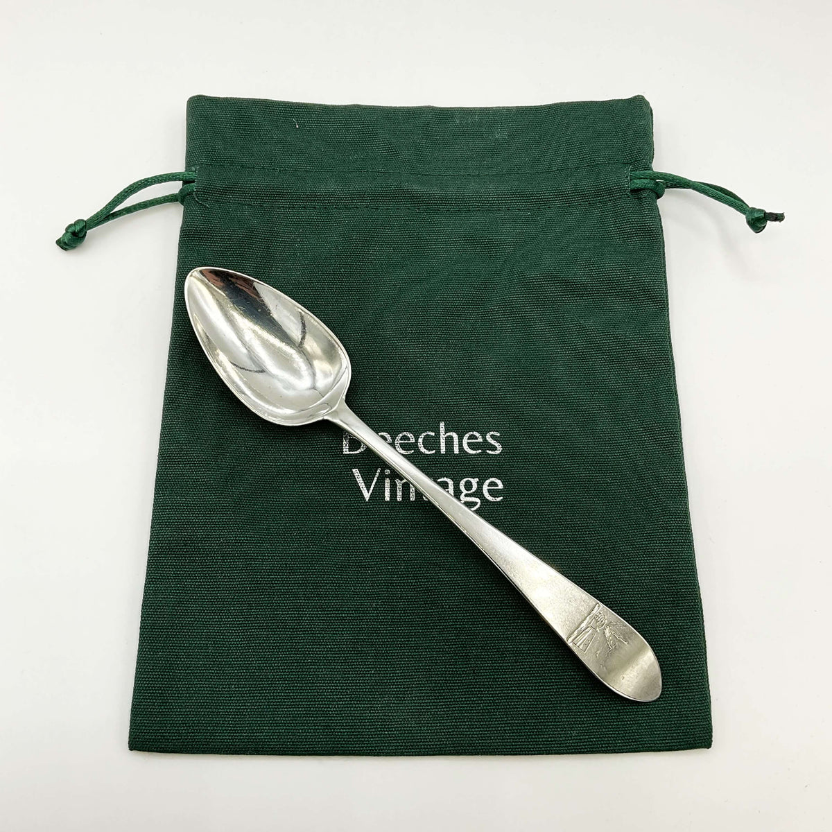 Sterling silver dessert spoon from the 1700s by Beeches Vintage, featuring ornate details and vintage craftsmanship.