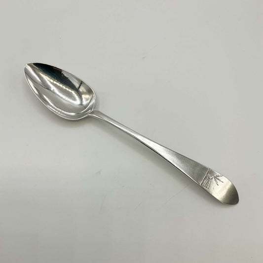 Sterling silver dessert spoon from the 1700s by Beeches Vintage, featuring ornate design and polished surface.