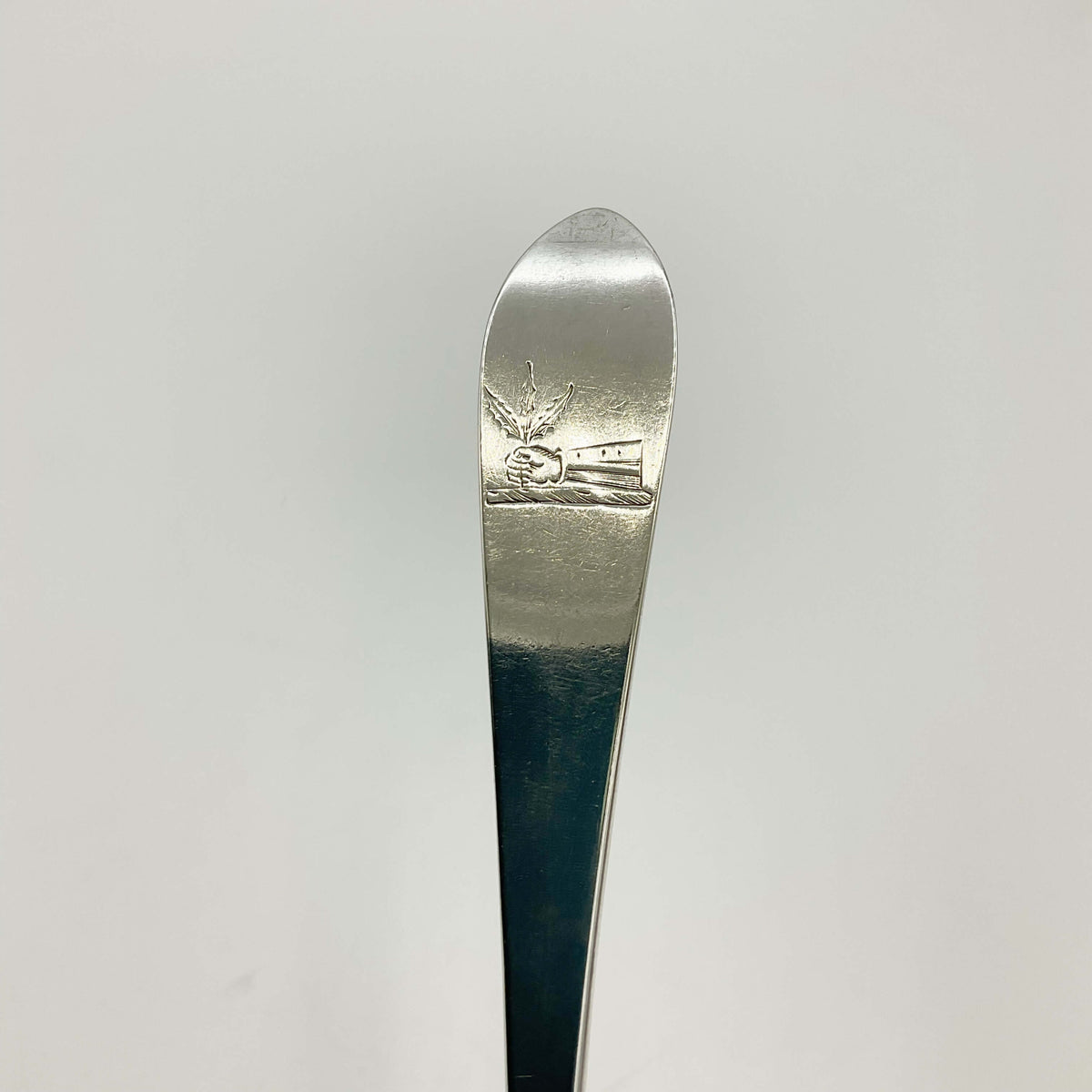 Vintage 1700s sterling silver dessert spoon from Beeches Vintage, detailed ornate handle and polished bowl.