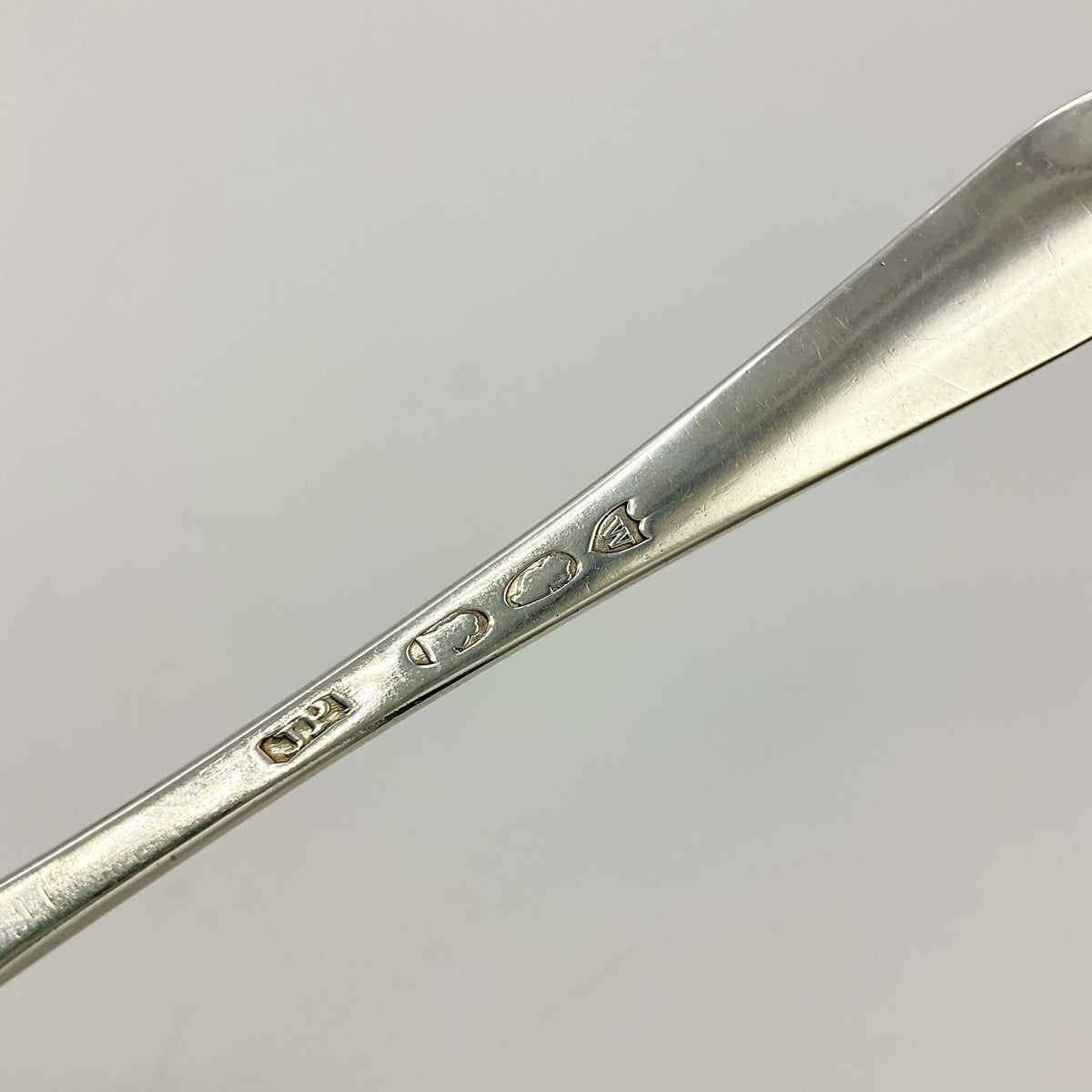 Sterling silver dessert spoon from the 1700s with ornate handle, vintage Beeches Silverware collection, detailed antique tableware.