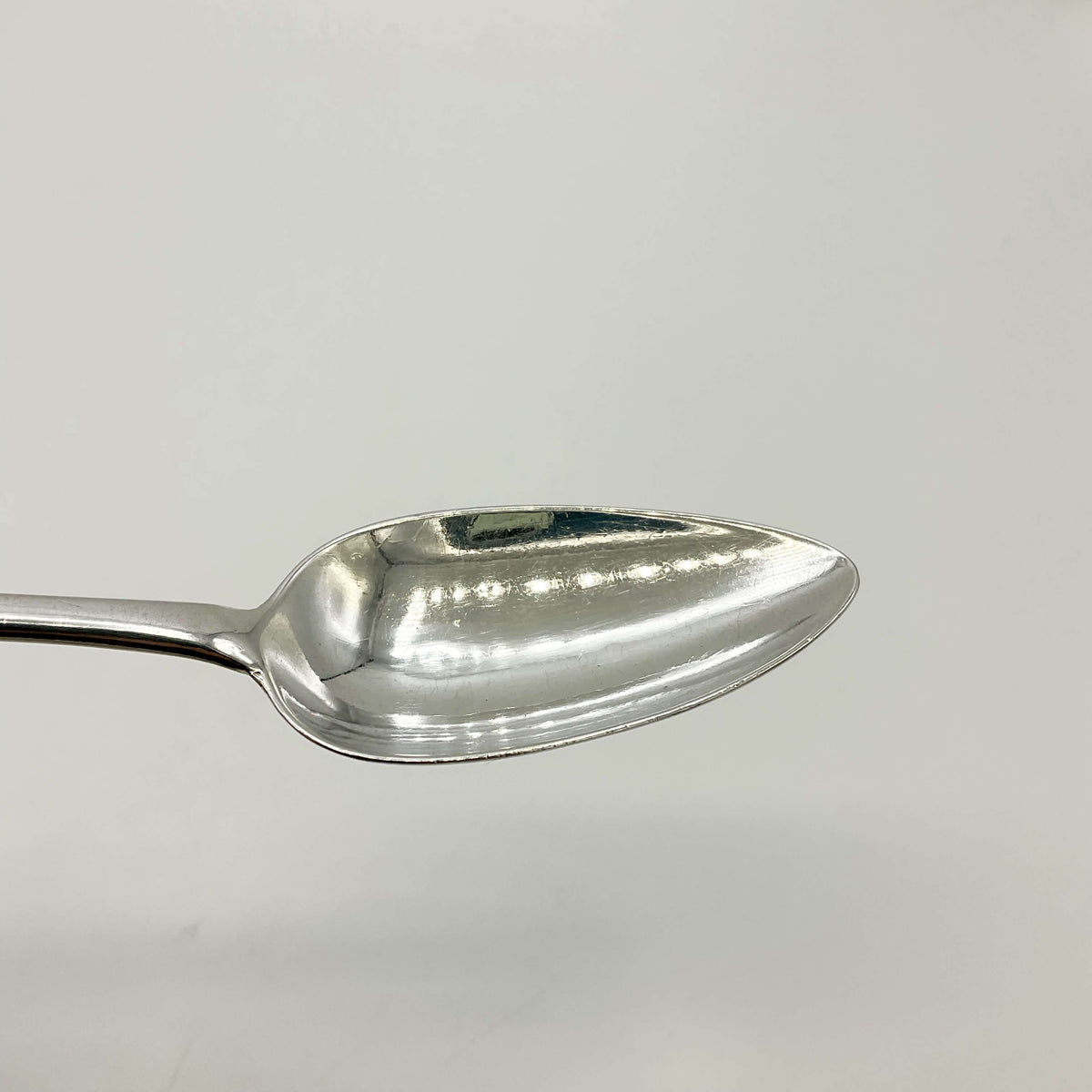 Vintage 1700s Sterling Silver Dessert Spoon by Beeches Vintage, showing intricate handle design and polished silver finish.