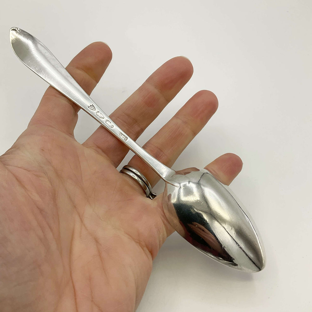 Vintage 1700s sterling silver dessert spoon by Beeches Vintage, detailed ornate handle and polished bowl.