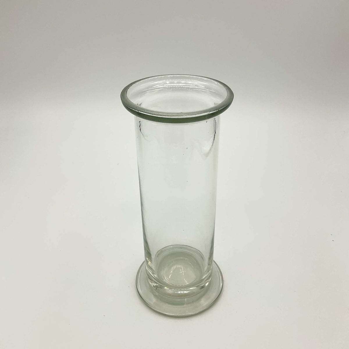Clear glass vintage cylinder vase by Beeches Vintage, showcasing its elegant, transparent design perfect for floral arrangements.