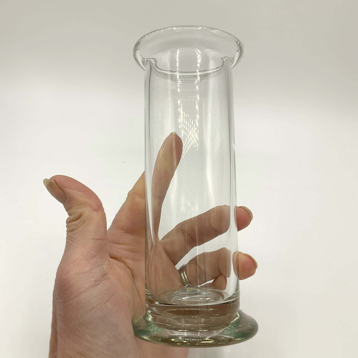 Clear glass vintage cylinder vase by Beeches Vintage, showcasing its elegant, transparent design perfect for floral arrangements.