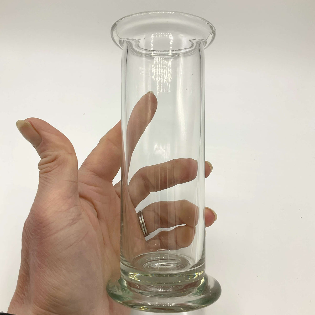 Vintage cylinder clear glass vase by Beeches Vintage, featuring a smooth, transparent design perfect for floral arrangements.