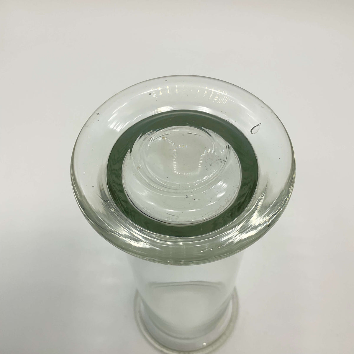 Clear glass vintage cylinder vase by Beeches Vintage, showcasing a transparent cylindrical design suitable for floral arrangements.
