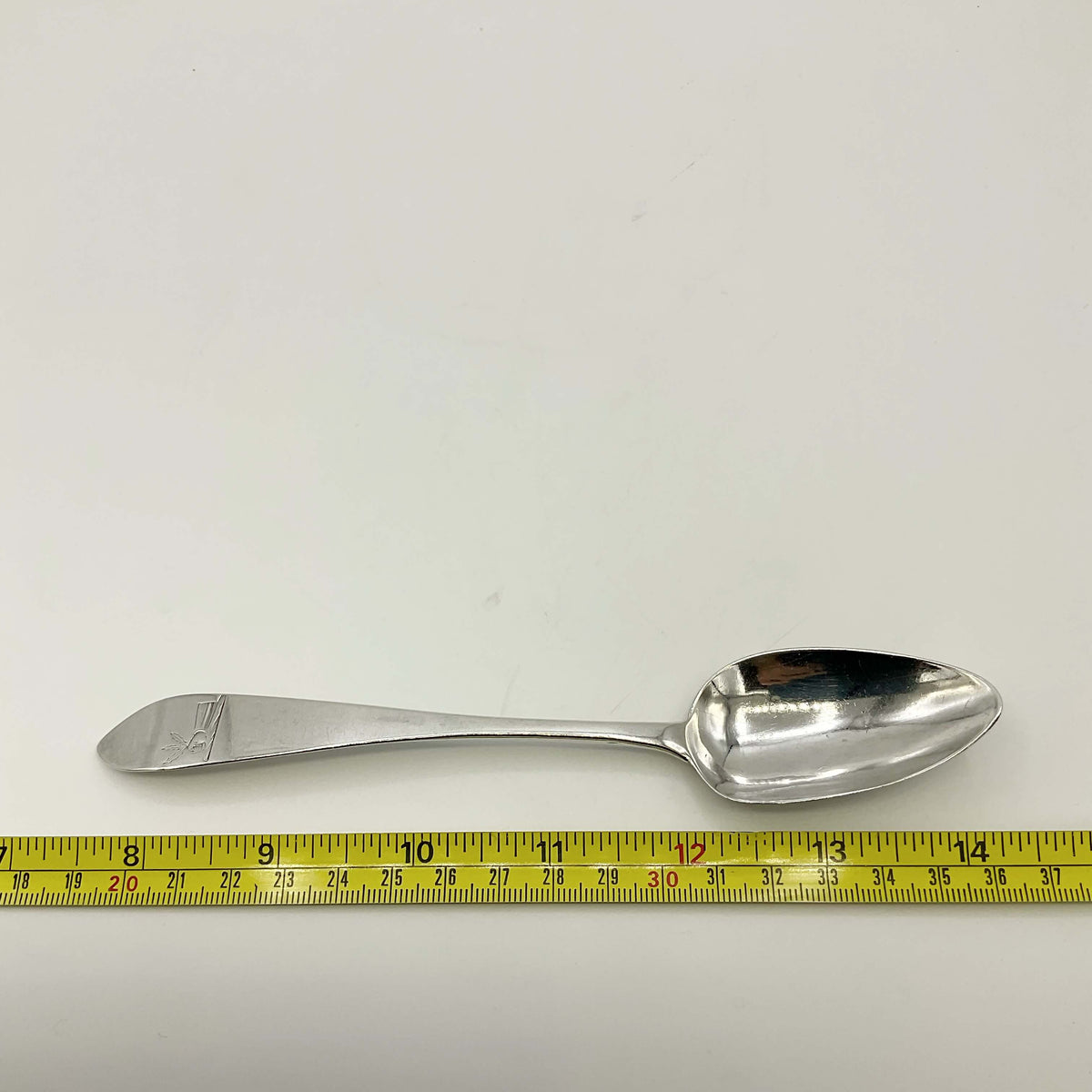 Antique 1700s Georgian sterling silver dessert spoon from Beeches Vintage, showcasing intricate vintage silverware design.