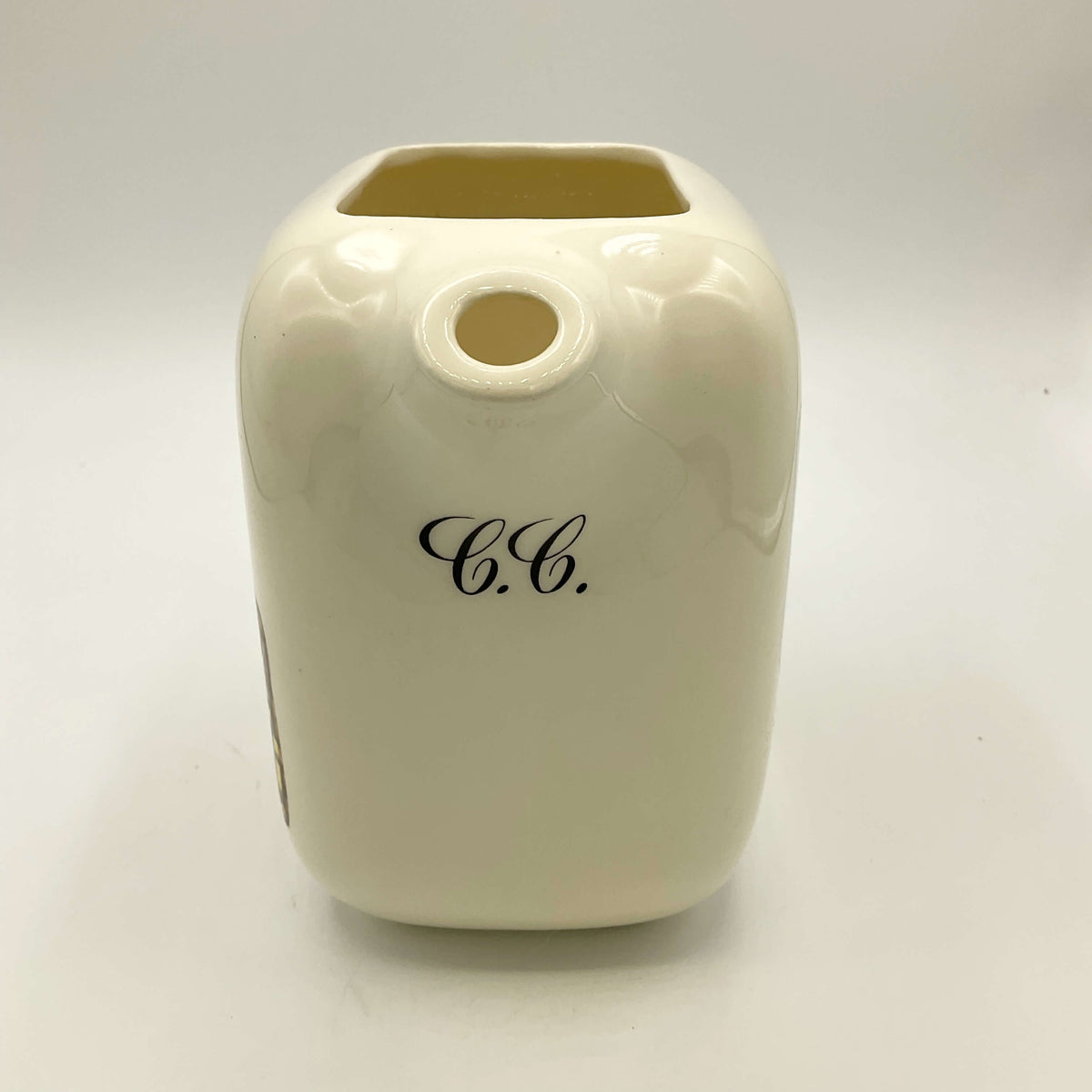 Front view showing CC on Canadian Club Whisky Water Jug  on a white background