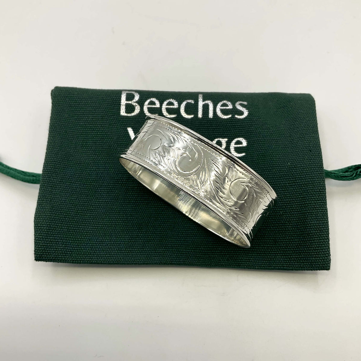 Solid sterling silver napkin ring by Beeches Vintage, featuring a smooth, polished design perfect for elegant table settings.