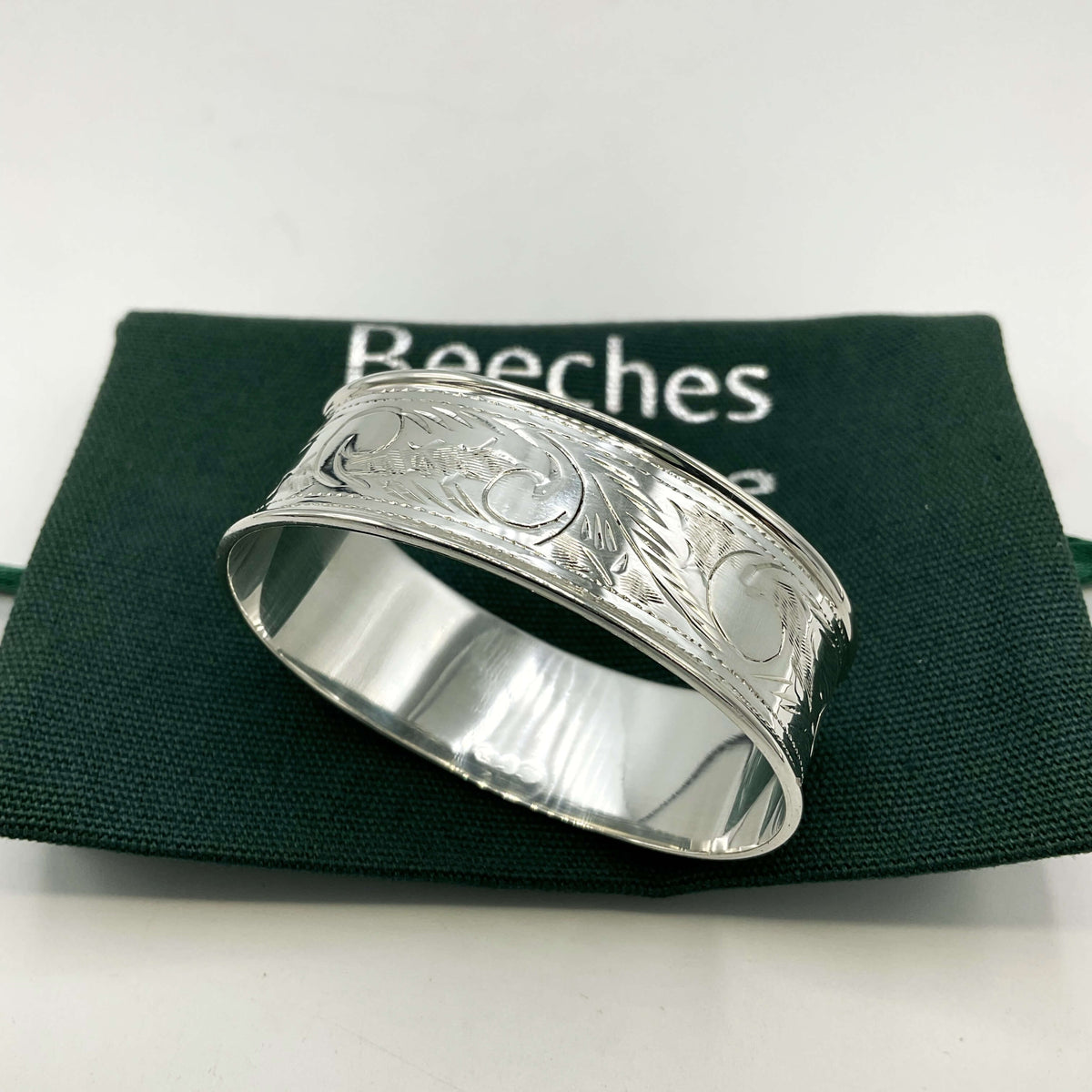 Solid sterling silver napkin ring by Beeches Vintage, featuring a smooth, polished finish and classic design for elegant table settings.