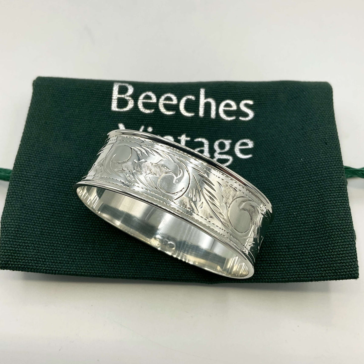 Solid sterling silver napkin ring by Beeches Vintage, featuring a smooth, polished finish for elegant table settings.