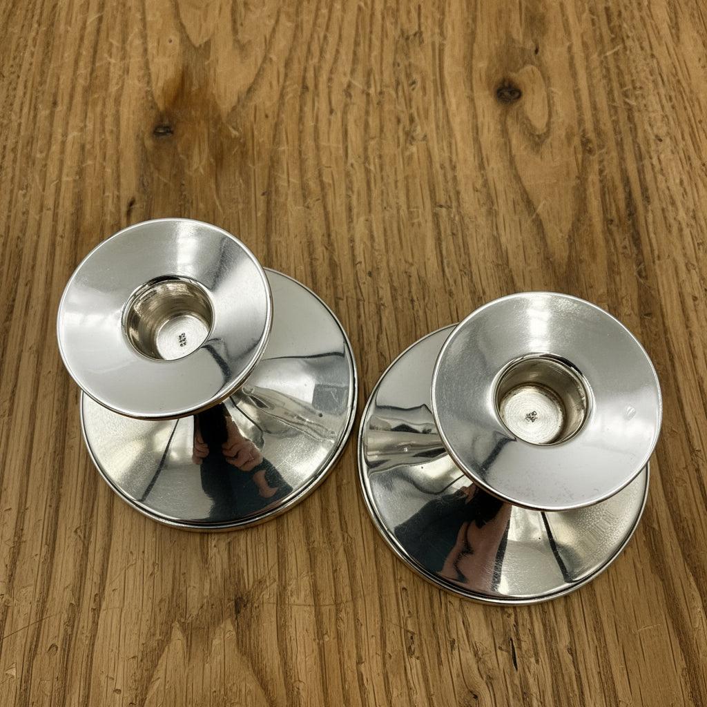 Tops of silver candlestick holders
