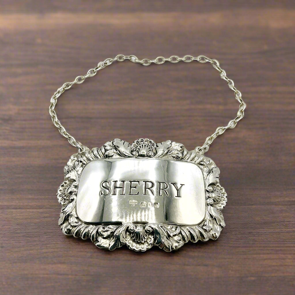 Silver sherry decanter label on a wooden table