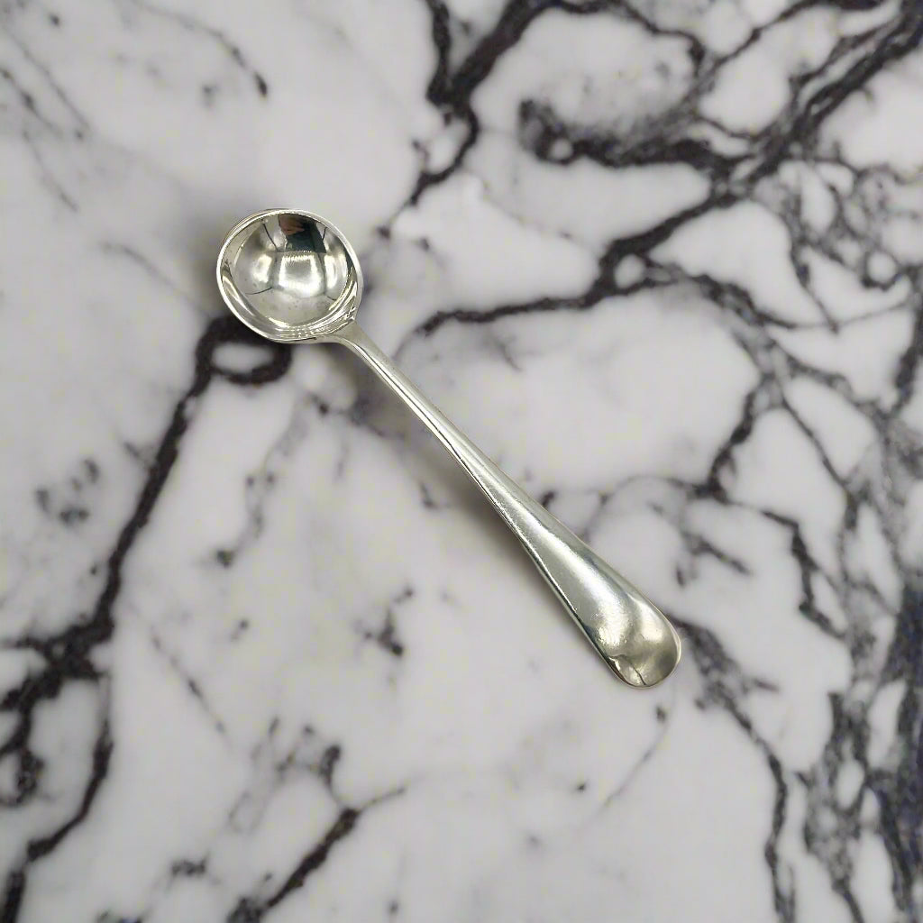 Silver spoon on a marble worktop