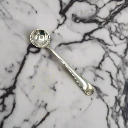 Silver spoon on a marble worktop