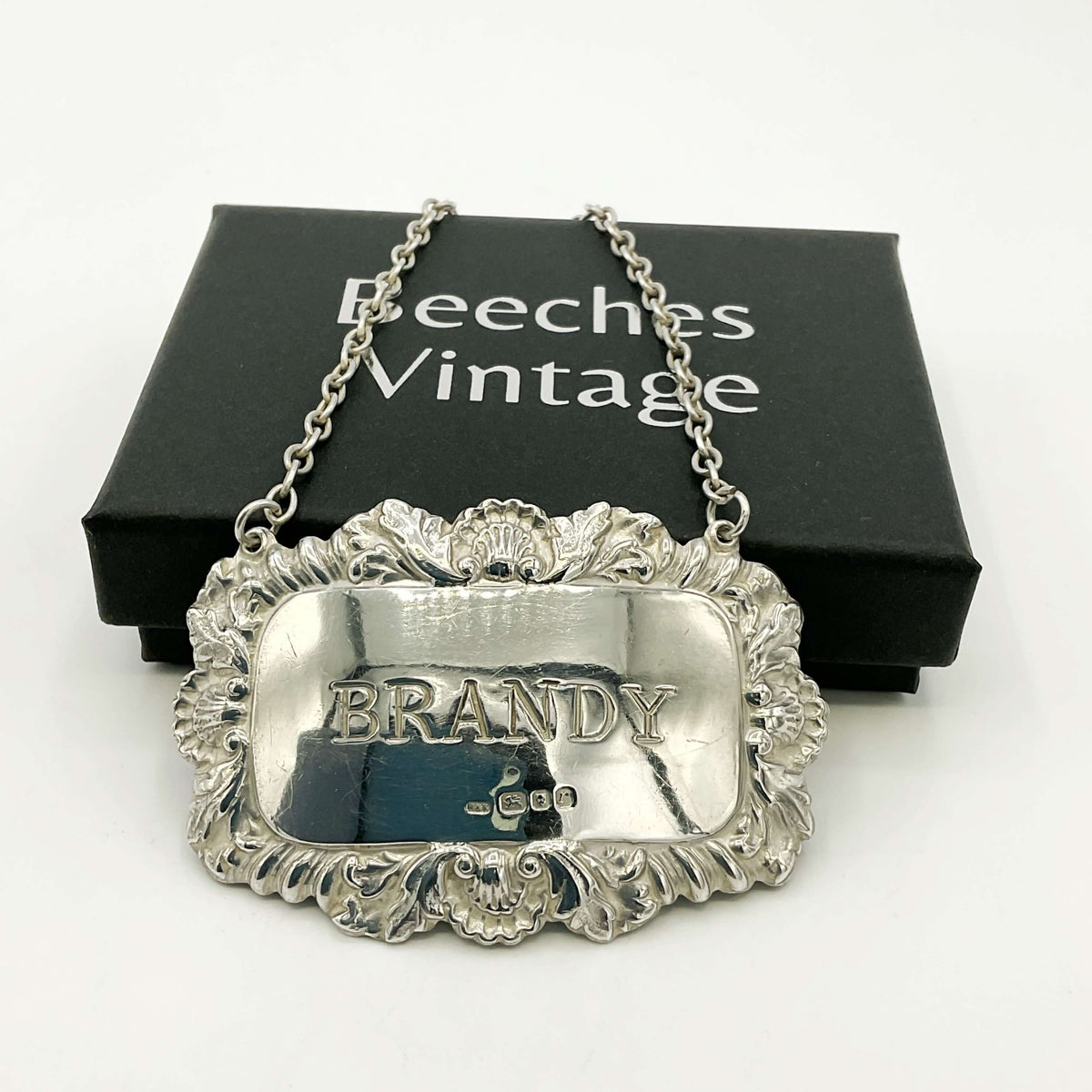 Silver brandy decanter label on a white background with 'Beeches Vintage' packaging and a white background.