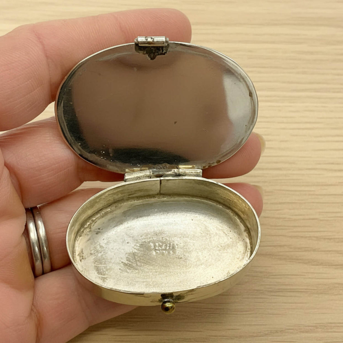 Mexican Abalone Shell Pill Box inside view held in hand