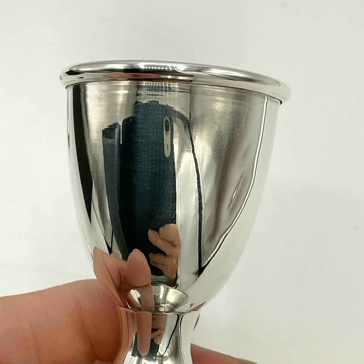 Sterling Silver Egg Cup held in hand against a white background