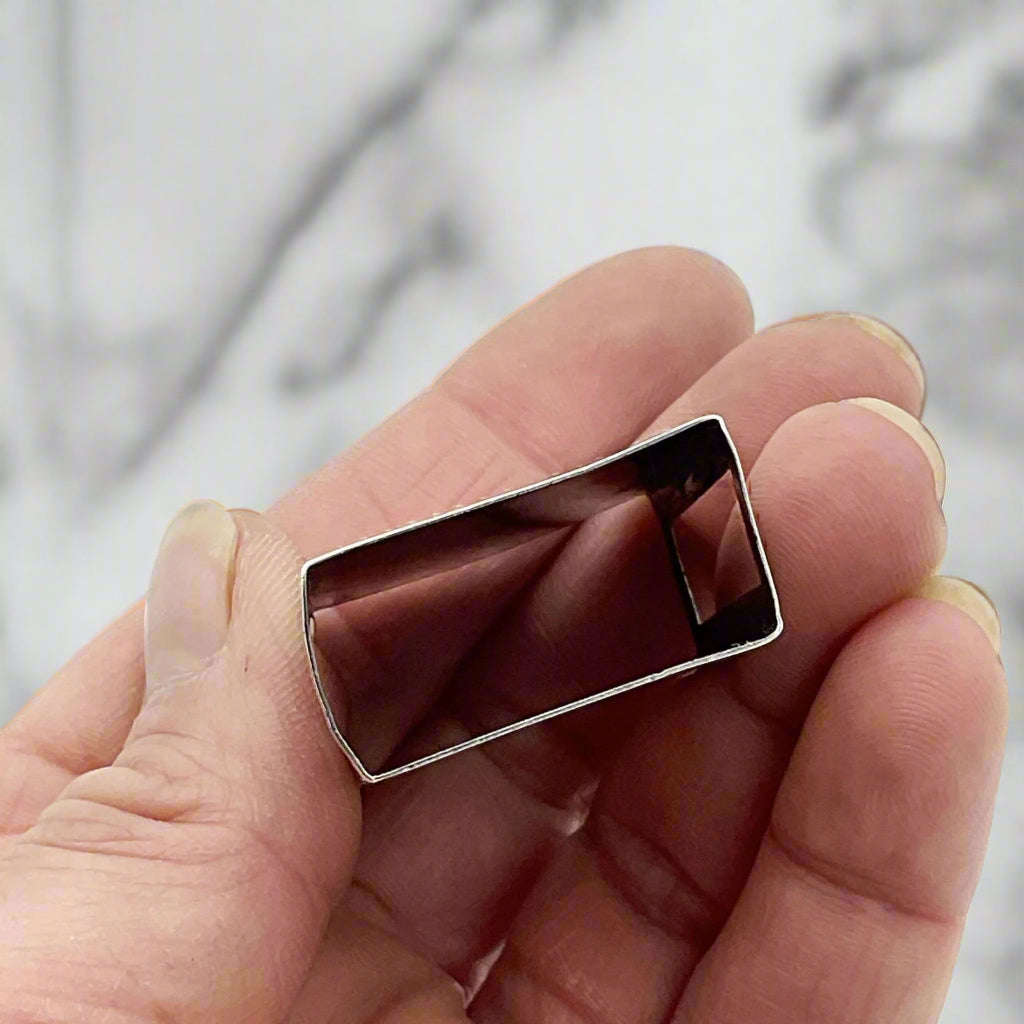 Matchbox in hand with marble surface