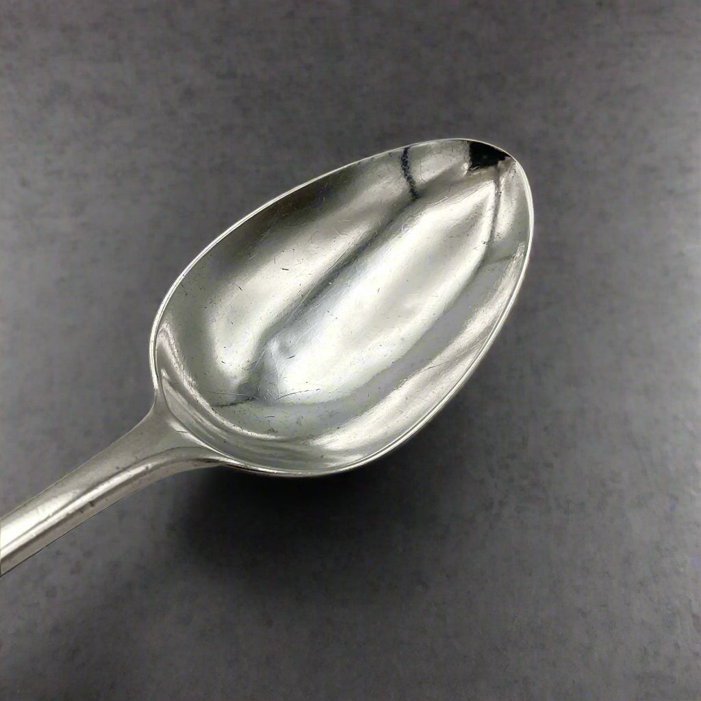 lovely silver bowl of tablespoon on grey granite background