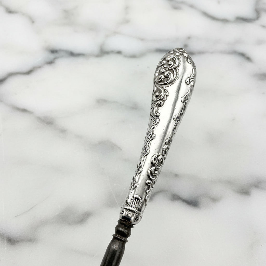 beautiful silver scrolls on the button hook handle