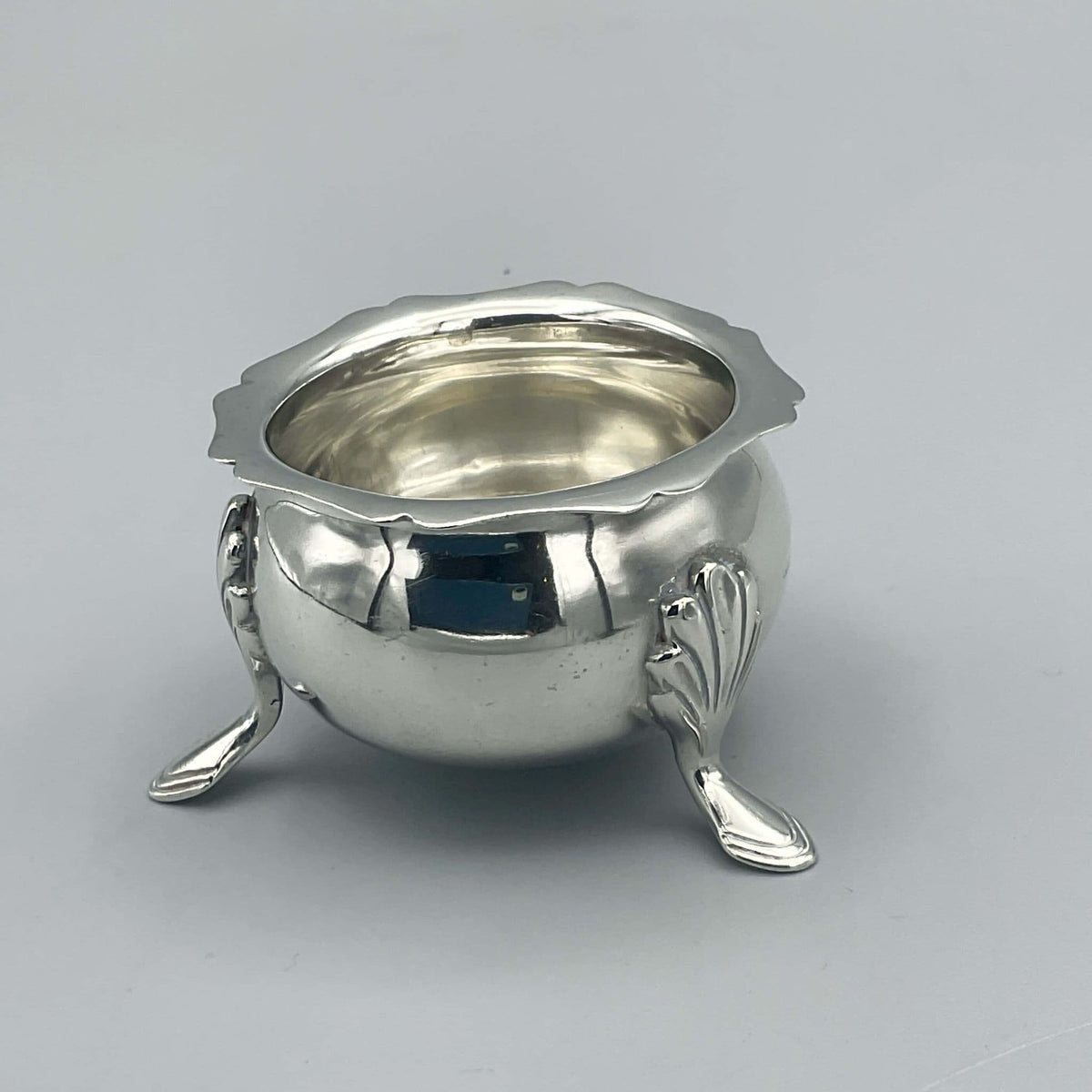 Antique 1908 Sterling Silver Salt Bowl and Rings Dish from Beeches Vintage, detailed silver bowl with ornate design.