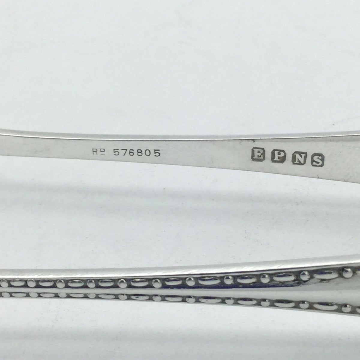 Inside of sugar tong arm with EPNS and RD 576805 inmprinted
