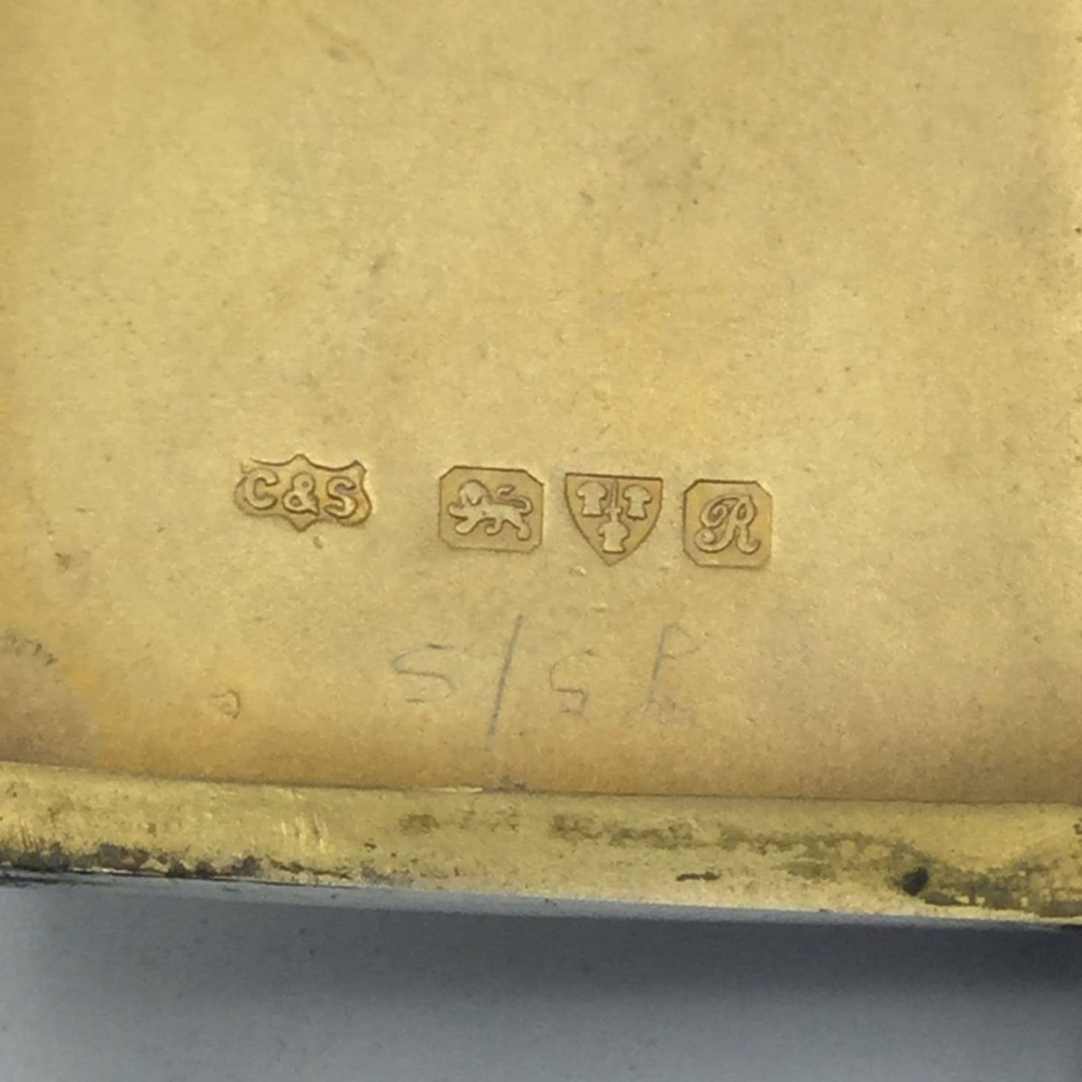 gilded golden interior of case showing hallmarks for Chester  1917 and C&S as the makers mark