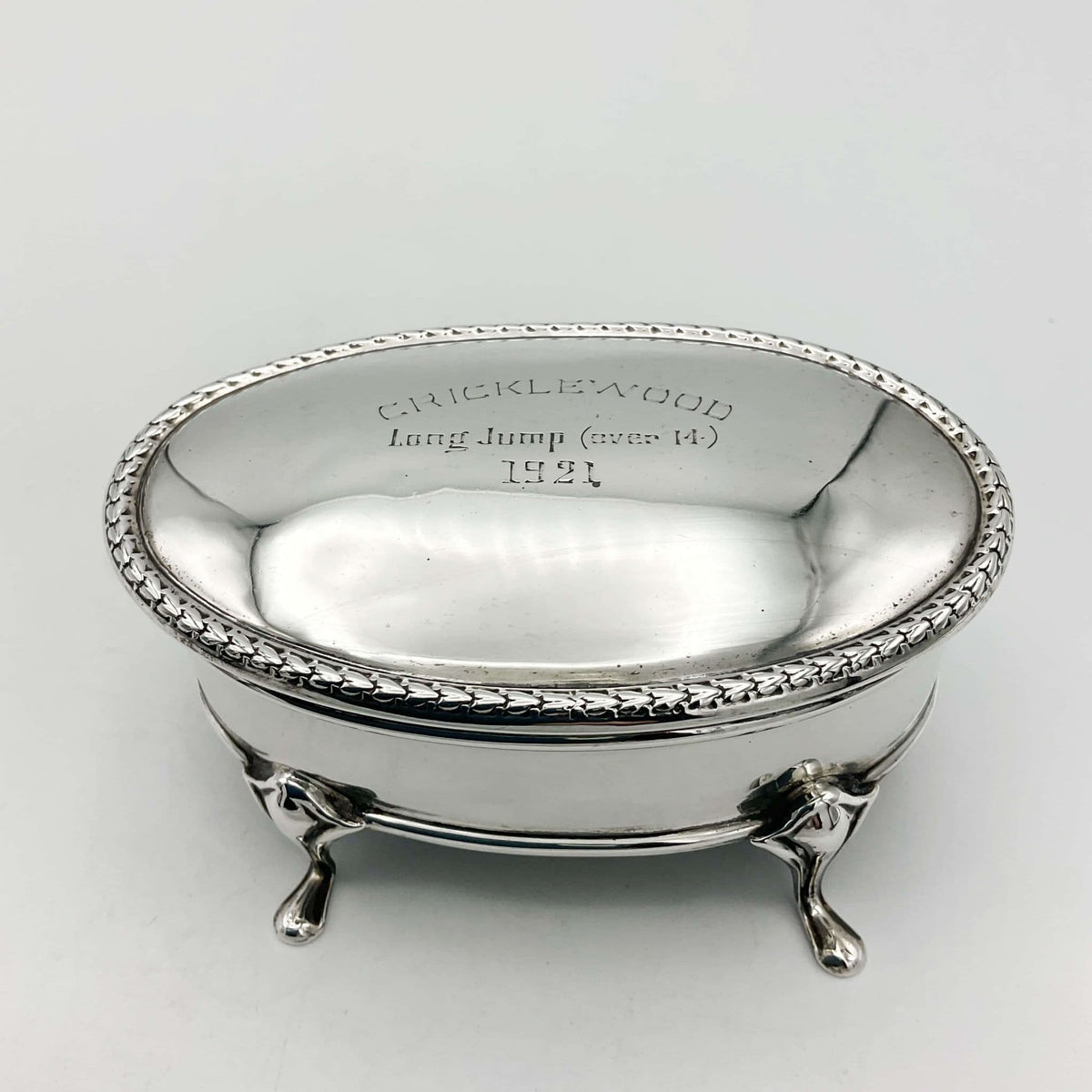 Antique 1919 sterling silver jewellery box by Beeches Vintage with intricate engraved details and a hinged lid.