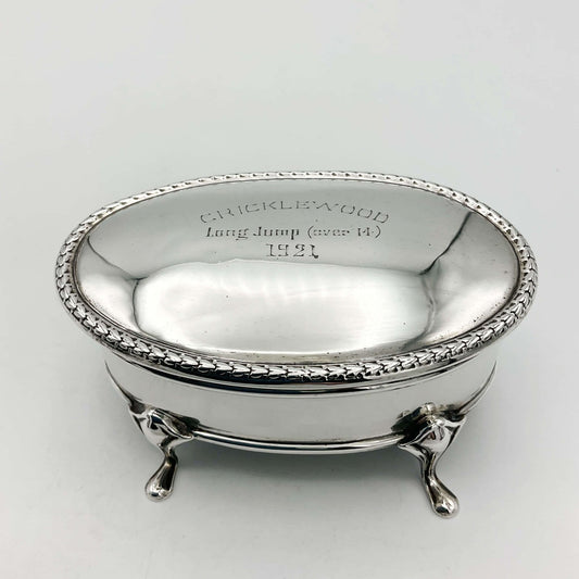 Antique 1919 sterling silver jewellery box by Beeches Vintage with intricate engraved details and a hinged lid.