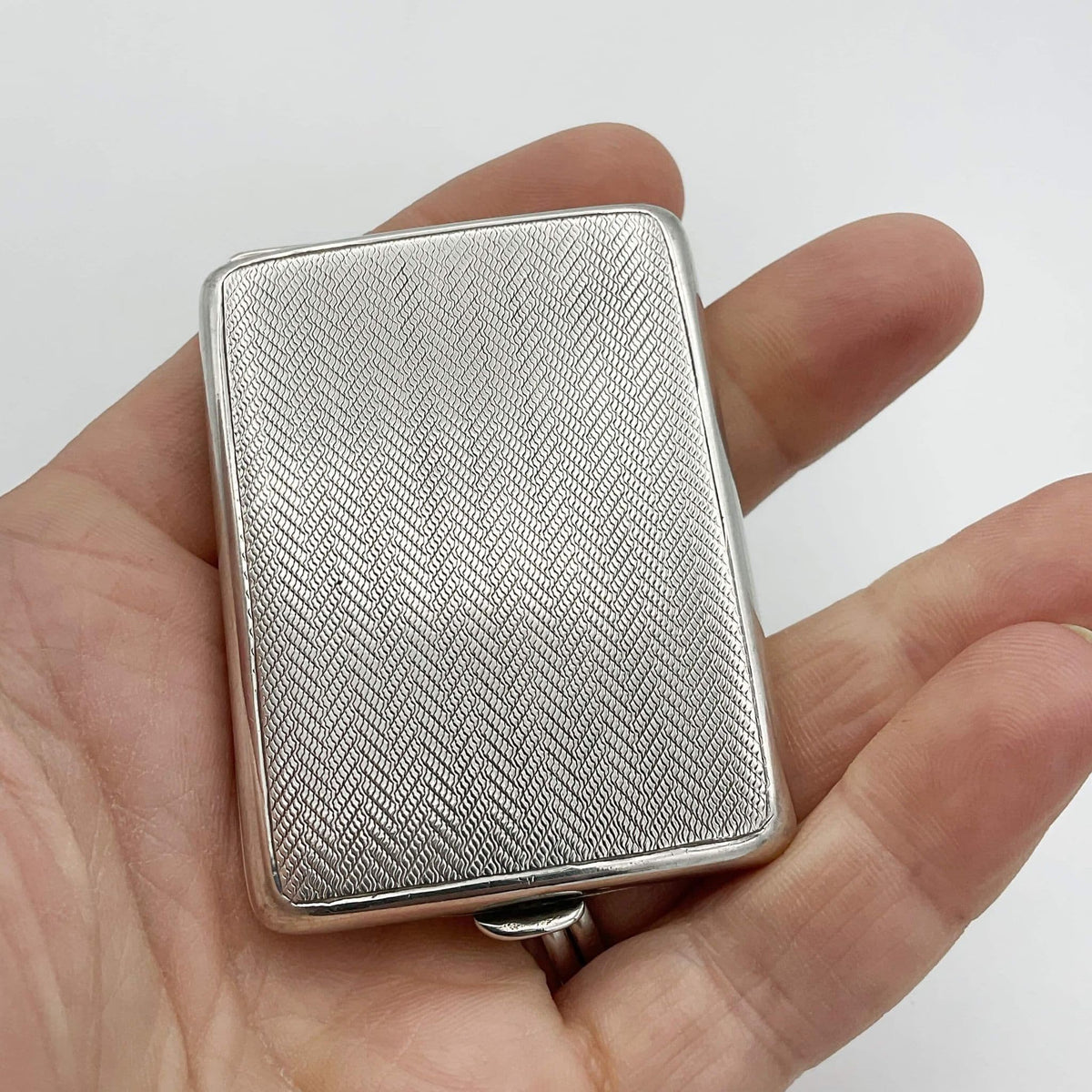 Antique silver 1921 matchbook holder with detailed engravings, vintage Beeches Vintage match case on a neutral background.